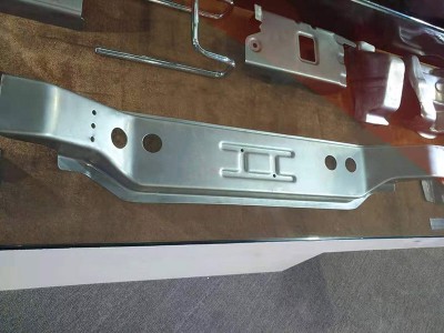 Car front main beam and reinforcement plate